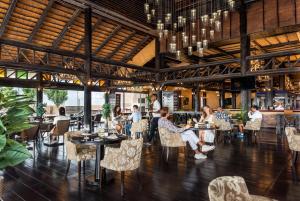 a restaurant with people sitting at tables at Al Maya Island & Resort in Abu Dhabi