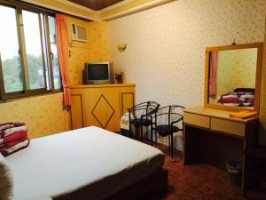 Letto o letti in una camera di Kai Cheng Inn 旅館134