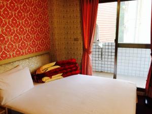 Letto o letti in una camera di Kai Cheng Inn 旅館134
