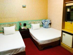 Letto o letti in una camera di Kai Cheng Inn 旅館134
