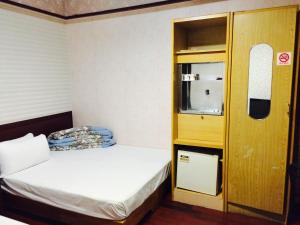 Letto o letti in una camera di Kai Cheng Inn 旅館134