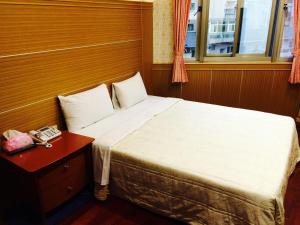 Letto o letti in una camera di Kai Cheng Inn 旅館134