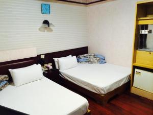 Letto o letti in una camera di Kai Cheng Inn 旅館134