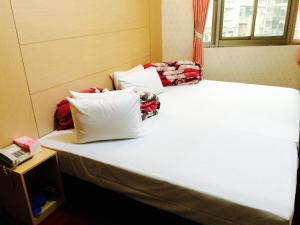 Letto o letti in una camera di Kai Cheng Inn 旅館134
