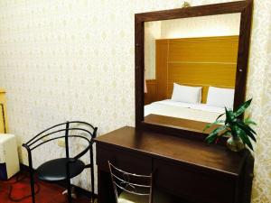 Letto o letti in una camera di Kai Cheng Inn 旅館134