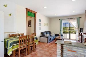 a living room with a couch and a table at Villa Perez Zara Paco in Campano