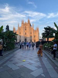 a group of people walking in front of a cathedral at Torino 64 - Duomo City Center Luxury Apt Perfect x2! Self Check-In in Milan