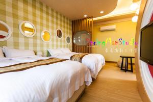 Voodi või voodid majutusasutuse Zhuyuan Ju B&B toas