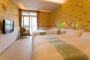 Voodi või voodid majutusasutuse Zhuyuan Ju B&B toas