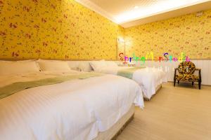 Voodi või voodid majutusasutuse Zhuyuan Ju B&B toas