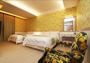 Voodi või voodid majutusasutuse Zhuyuan Ju B&B toas