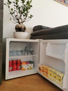 a small refrigerator with food and drinks in it at Residenza San Niccolò in Florence