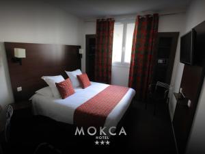 Postel nebo postele na pokoji v ubytování Le Mokca