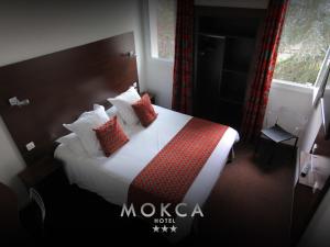 Voodi või voodid majutusasutuse Le Mokca toas