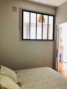 Posteľ alebo postele v izbe v ubytovaní Appartement cosy en ville haute