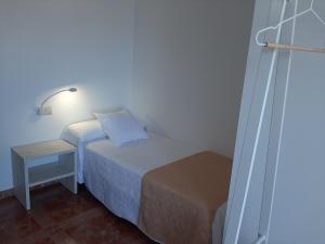 Postel nebo postele na pokoji v ubytování Apartamentos Costas de Bueu B