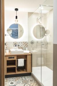 a bathroom with a sink and a shower at Blauer Bock in Passau