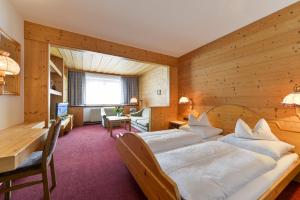 Postel nebo postele na pokoji v ubytování Hotel Bergheim