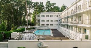 an external view of a building with a swimming pool at Narva-Jõesuu Medical Spa in Narva-Jõesuu