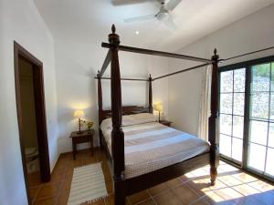 a bedroom with a canopy bed in a room at Padre Aviles in Olías