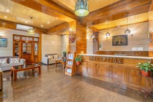 a lobby with a reception desk in a building at Summit Alpine Abode Hotel Centrally Air Conditioned in Gangtok