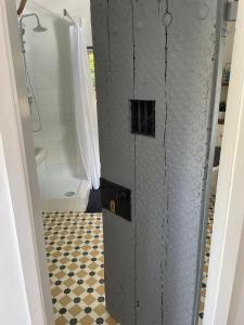 a bathroom with a walk in shower and a toilet at The Gatehouse in Long Melford