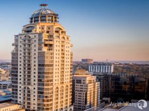 a tall building with a dome on top of it at Luxury Apartment - Michelangelo Towers in Johannesburg