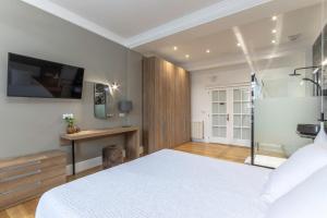 Кровать или кровати в номере Habitaciones Apartamento B&B Plaza Nueva 8