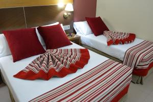 Posteľ alebo postele v izbe v ubytovaní Hotel Regio 2