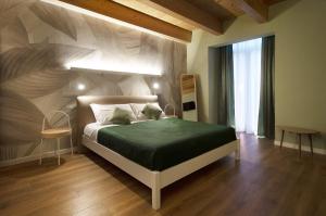 Postel nebo postele na pokoji v ubytování B&b Porta Arpana- Camere & Appartamenti Deluxe in centro