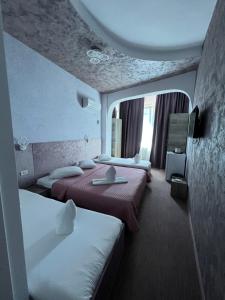 Postel nebo postele na pokoji v ubytování Hotel Minion