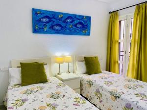 Posteľ alebo postele v izbe v ubytovaní Beach Bungalow Holiday Home