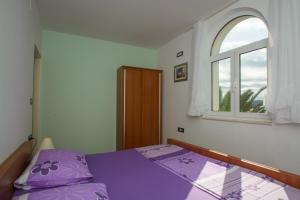 Ένα ή περισσότερα κρεβάτια σε δωμάτιο στο Apartments Jerkunica