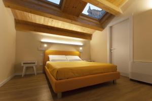 Postel nebo postele na pokoji v ubytování B&b Porta Arpana- Camere & Appartamenti Deluxe in centro