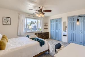 a bedroom with a bed and a window at RARE FIND Modern Townhome in the Heart of Old Colorado City in Colorado Springs