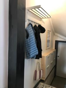 a room with a closet with a blue bag in it at Chalet basque 6 couchages centre ville Biarritz in Biarritz