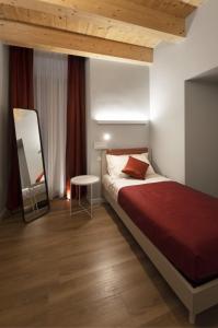 Postel nebo postele na pokoji v ubytování B&b Porta Arpana- Camere & Appartamenti Deluxe in centro