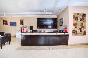 a lobby with a bar in a restaurant at Dunia Hotel Bamako in Bamako