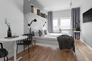 Säng eller sängar i ett rum på Forenom Hotel Kista