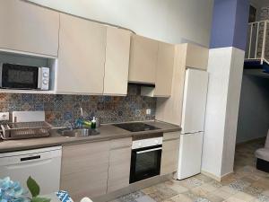 Kuchyňa alebo kuchynka v ubytovaní Urban Loft + 26 fotografií