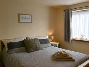 a bedroom with a bed with a tray on it at The Old Rectory Lodge in Great Carlton