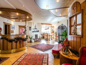 a large living room with a table and chairs at Hotel Garni Daniel in Ischgl