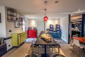 a kitchen with a table and a red refrigerator at greet La Teste Bassin d'Arcachon in La Teste-de-Buch