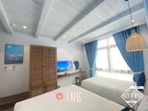 Postel nebo postele na pokoji v ubytování Riverside Mini Hotel Grand World Phu Quoc