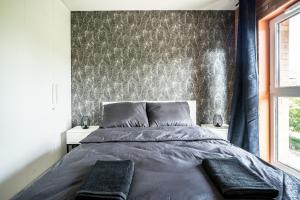 Ένα ή περισσότερα κρεβάτια σε δωμάτιο στο Grand Lux apartment Grodzienska Near to theOldTown