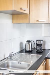 a kitchen with a sink and a counter top at Chez Welter in Argelès-Gazost