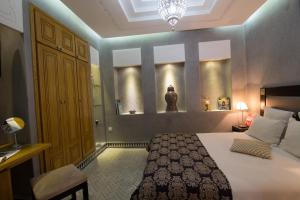 Voodi või voodid majutusasutuse Riad L'Etoile D'Orient toas
