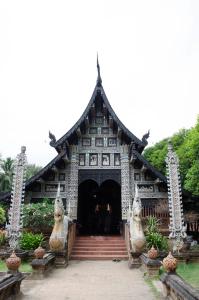 a large building with a staircase in front of it at i-smile & U2 Hostel in Chiang Mai