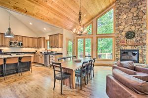 a kitchen and living room with a table and chairs at Luxe Wintergreen Resort Escape with Hot Tub! in Roseland