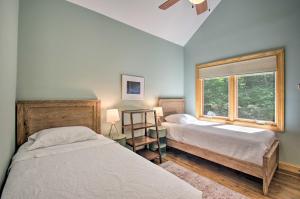 a bedroom with two beds and a window at Luxe Wintergreen Resort Escape with Hot Tub! in Roseland
